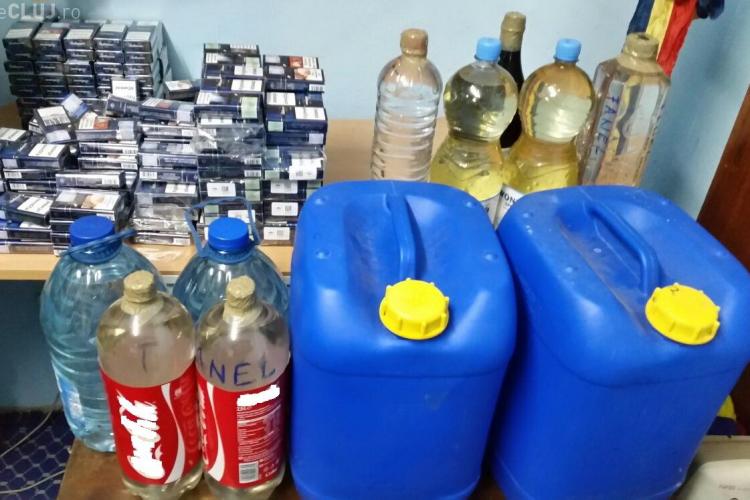 Mii de țigarete și zeci de litri de alcool, confiscate de polițiști la Cluj FOTO 