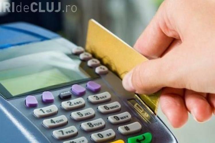 Românii vor putea scoate bani de pe card direct din magazine, începând cu anul viitor