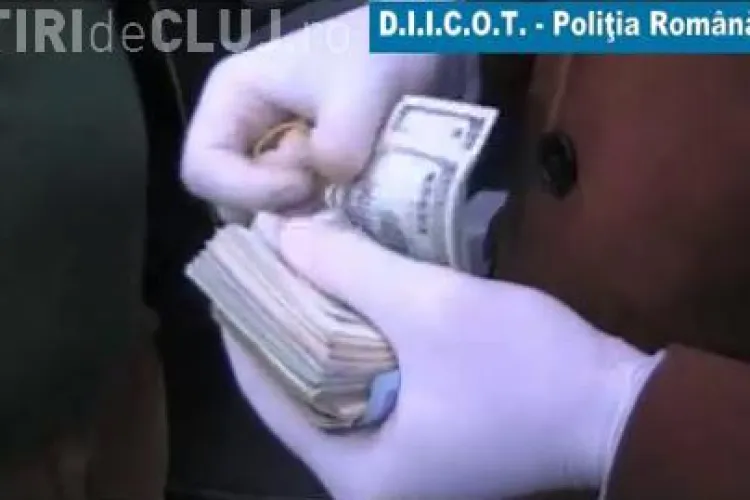 O retea care a pus si la Cluj in circulatie dolari falsi a fost anihilata de procurorii DIICOT - VIDEO