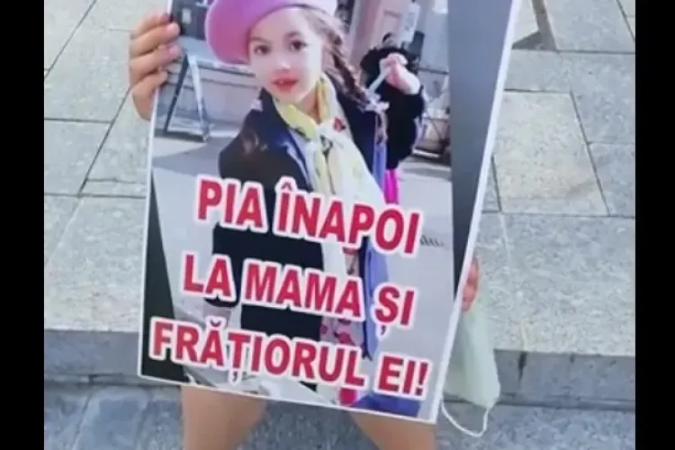 Flash Mob în centrul Clujului de susținere cu familia fetiței Pia Furdui, care e luată cu forța de Protecția Copilului din Germania - VIDEO
