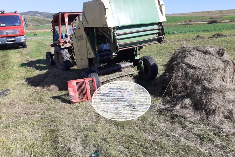 Moarte SINISTRĂ la Cluj. Un tânăr a fost prins într-un utilaj de balotat fân - VIDEO