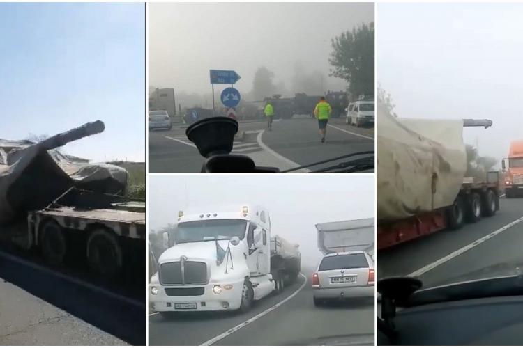 VIDEO - Convoi cu tancuri pentru Ucraina, blocat într-o localitate din Sălaj. Unul dintre șoferi s-a împotmolit și a oprit traficul