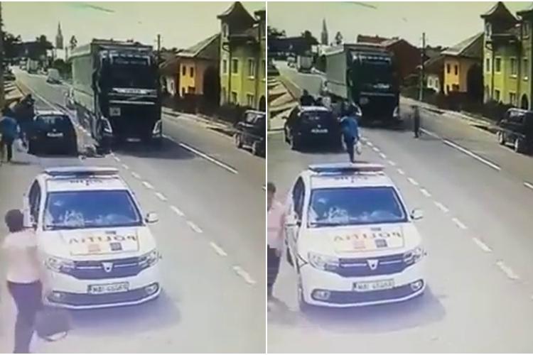 ”Ferească bunul Dumnezeu!” - Polițistă lovită de un camion când traversa în fugă strada - VIDEO