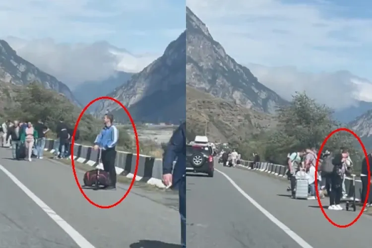 VIDEO - Rușii fac tot posibilul pentru a ieși din țară: Mulți fug cu trotineta. Cozile la vamă durează chiar și 10 ore