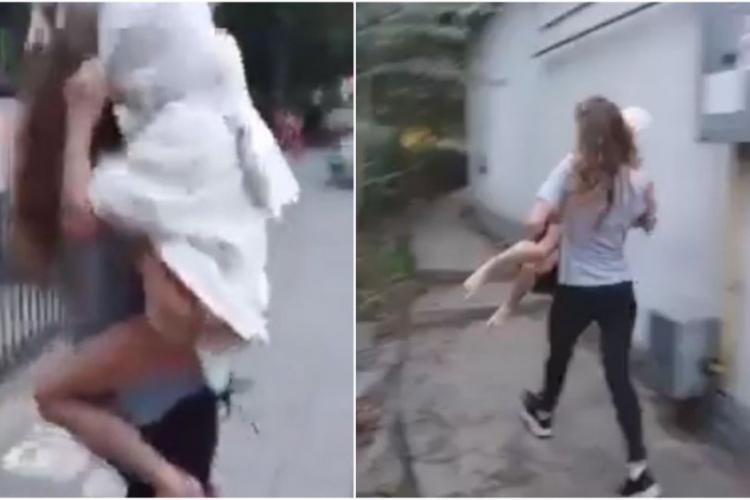 VIDEO - O tânără a vrut să își arunce fetița în fața mașinilor: „Ea vede tot, este posedată!”. Trecătorii au reușit să o oprească la timp 