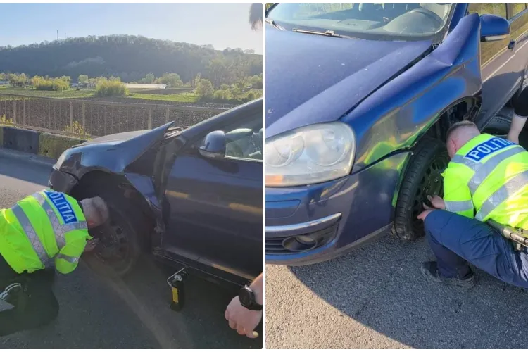 Doi polițiști din Ardeal au ajutat un tânăr în dificultate să își schimbe roata - FOTO