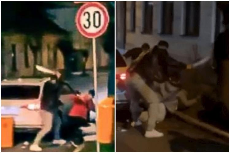 VIDEO. Bătaie cu macete, pumni și picioare pe o stradă din Reghin. Au smuls coșurile stradale pentru a le folosi ca și arme!
