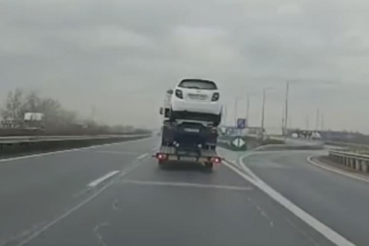 Român prins în Ungaria în timp ce transporta o mașină în remorca unui autovehicul aflat pe o platformă - FOTO