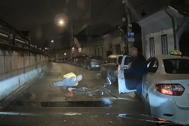 Livrator din Cluj, accidentat de un taximetrist neatent! Era întins pe carosabil, dar șoferul a verificat mai întâi dacă și-a stricat portiera VIDEO