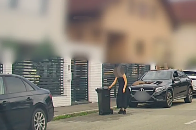 VIDEO. Modă la Cluj! Ai bolid de lux și stai pe o stradă de fitze, dar nu bagi mașina în curte: „Rezervi” locul de parcare cu tomberonul, în fața casei!