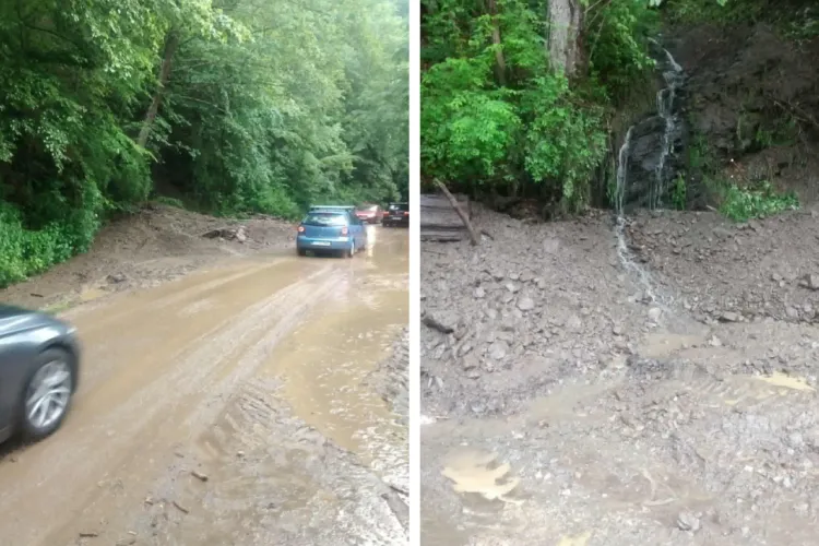 Intervenție de urgență pe un drum din Cluj după furtuni! Aluviuni și roci au blocat drumul, echipele CJ Cluj au degajat carosabilul cu buldoexcavatorul