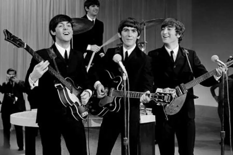 Vaticanul ii iarta pe Beatles pentru blasfemie