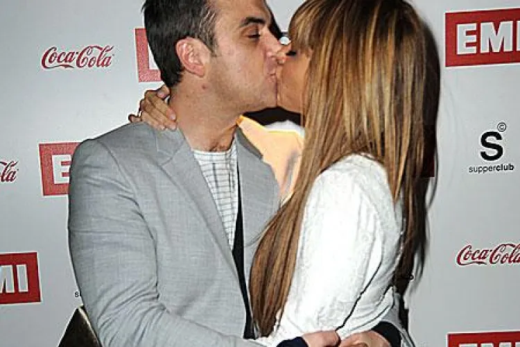 Robbie Williams vrea sa aiba proprii copii si apoi sa adopte doi copii din Haiti